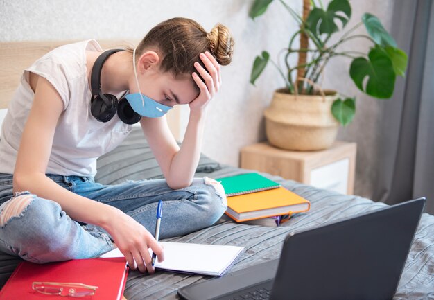 Schoolgirl studing at home