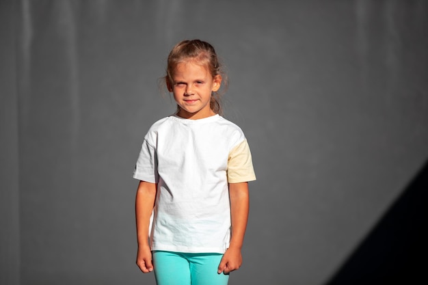 Schoolgirl in white tshirt space for your logo or design