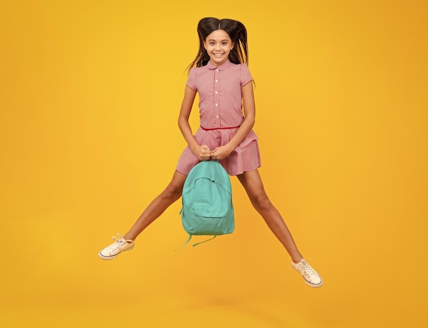 Photo schoolgirl with backpack teenager student isolated background learning and knowledge go study crazy