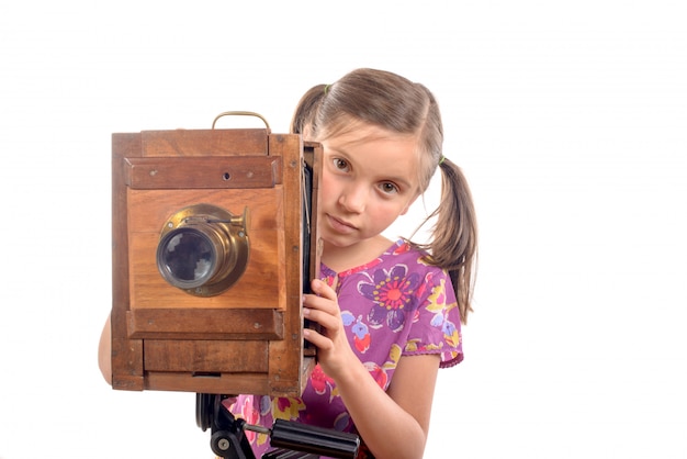 Schoolgirl with old camera