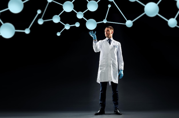 science, biology and people concept - doctor or scientist in white coat and medical gloves with molecules over black background