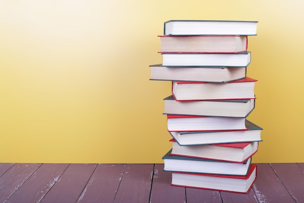 Science and education group of colorfull books on the wooden table