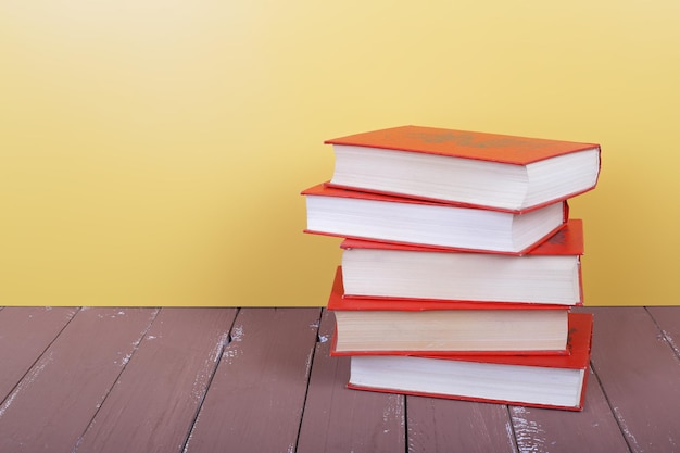 Science and education group of red books on the wooden table