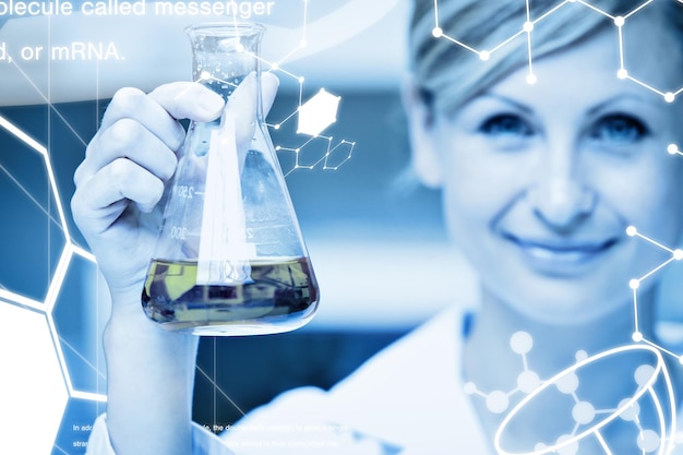 Photo science graphic against close up of a female scientist holding an erlenmeyer and smiling at the camera