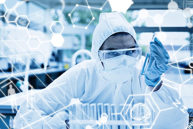 テスト チューブを保持している保護された女性科学者に対する科学グラフィック