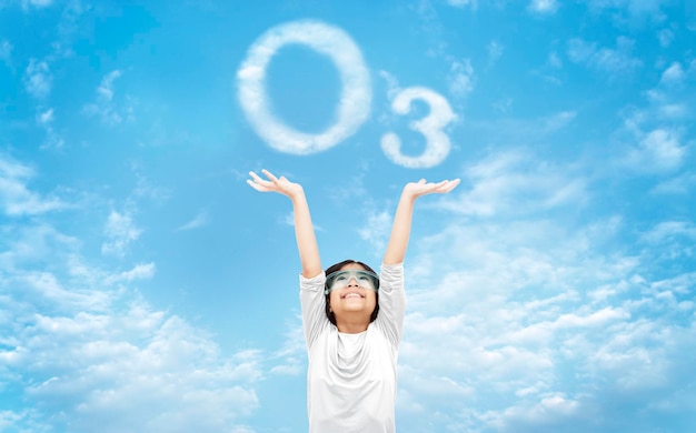 Science kid happy fresh air on clear sky with cloud as ozone symbol the good environtment concept on world ozone day