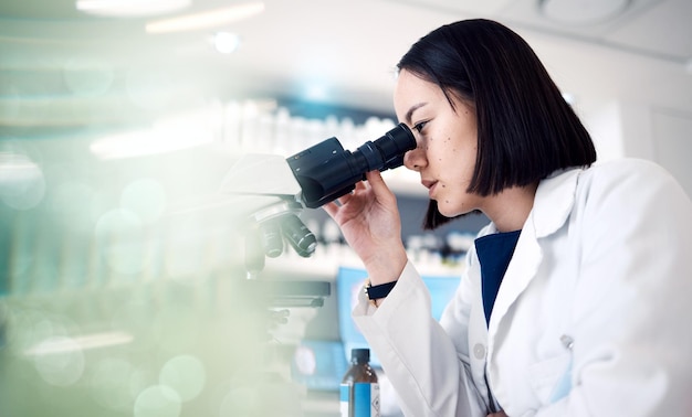 Science microscope and woman in laboratory for research medical innovation and test Female scientist biotechnology and expert staff working on dna analysis healthcare investigation and analytics