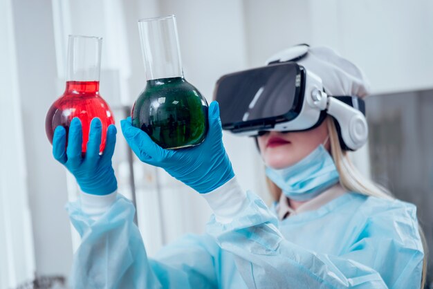 Science technician in virtual reality glasses examines the drug in laboratory.