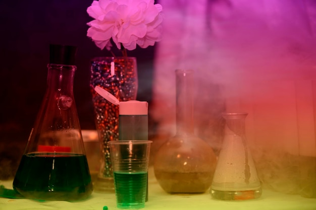 Scientific chemical experiments with test tubes colored smoke and multicolored solutions