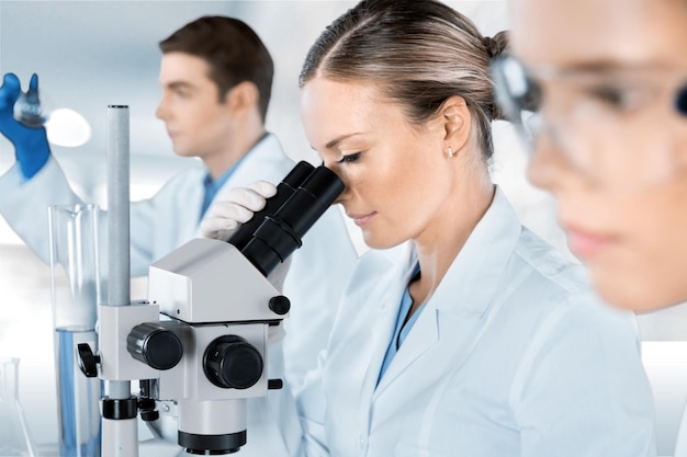 Scientific researcher using a microscope.