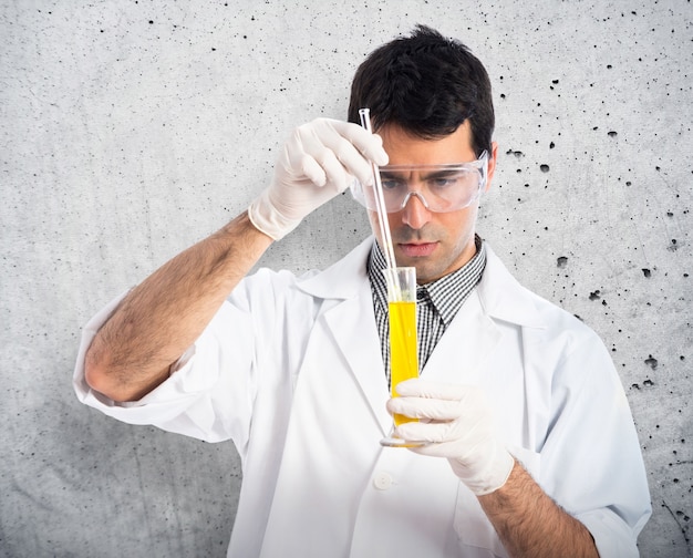 Scientist analyzing a test-tube