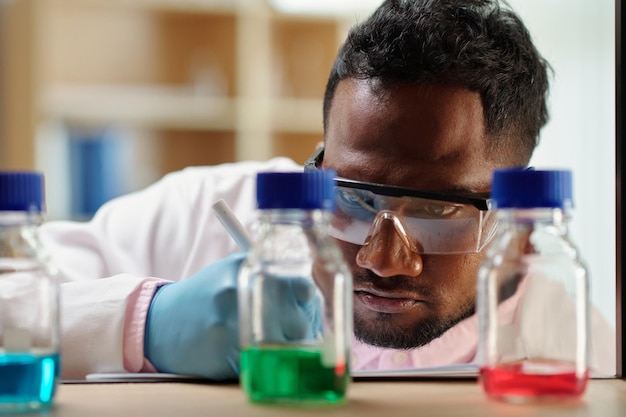 Scientist Checking Regents in Laboratory