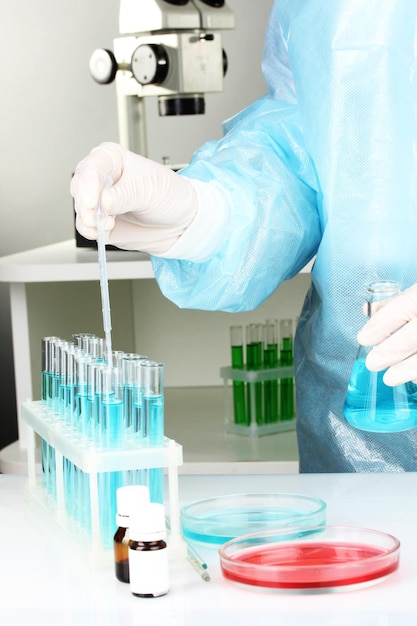 Scientist conducting research in laboratory close up