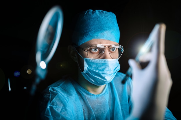 Scientist doctor in the laboratory examines the samples of the virus in vitro vaccine development c