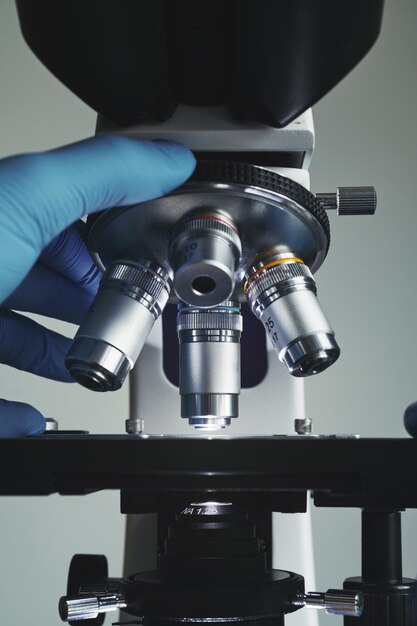 Scientist hands with microscope