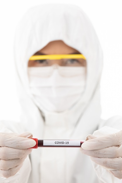 Scientist holding covid-19 test tube