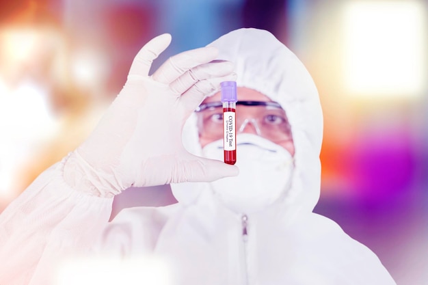 Scientist holding a Covid19 test tube in sparkles