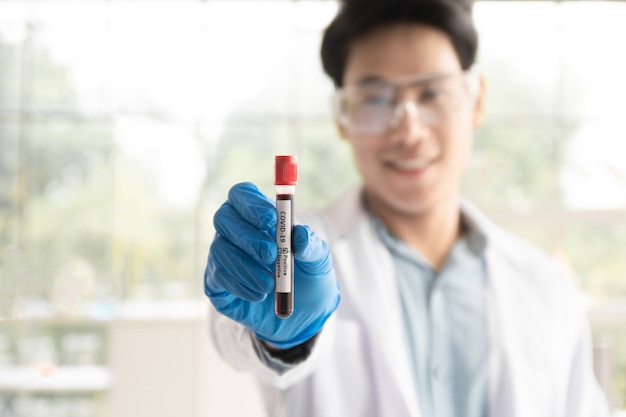 Scientist Holding a test tube in the lab