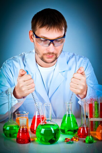 scientist in laboratory with test tubes