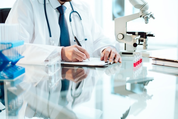 Scientist making research records in a medical laboratory