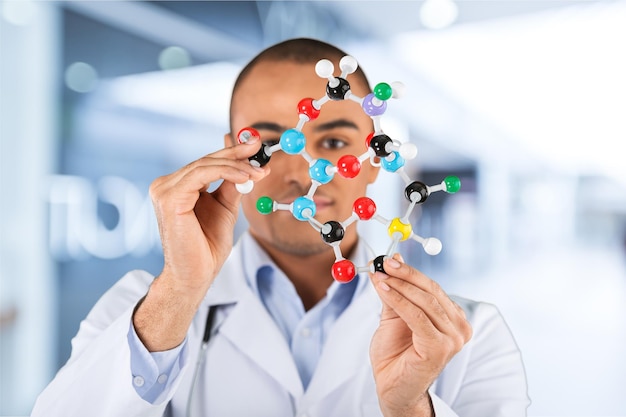 Scientist man holding molecule form isolated