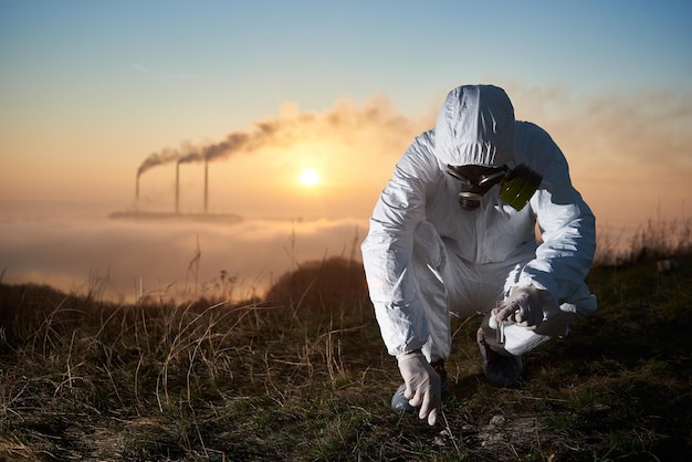 Scientist and smoking stacks of thermal power station