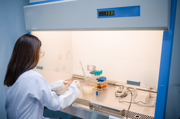 Photo scientist used chemical solution and equipment lab testing for bacteria