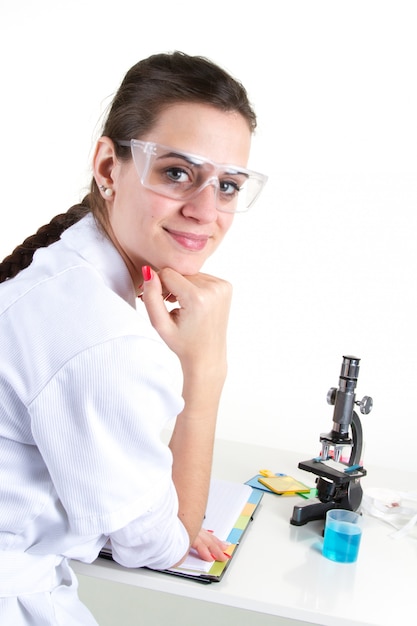 Scientist using a microscope in a laboratory