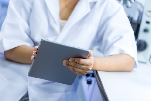 Scientist using tablet in laboratory