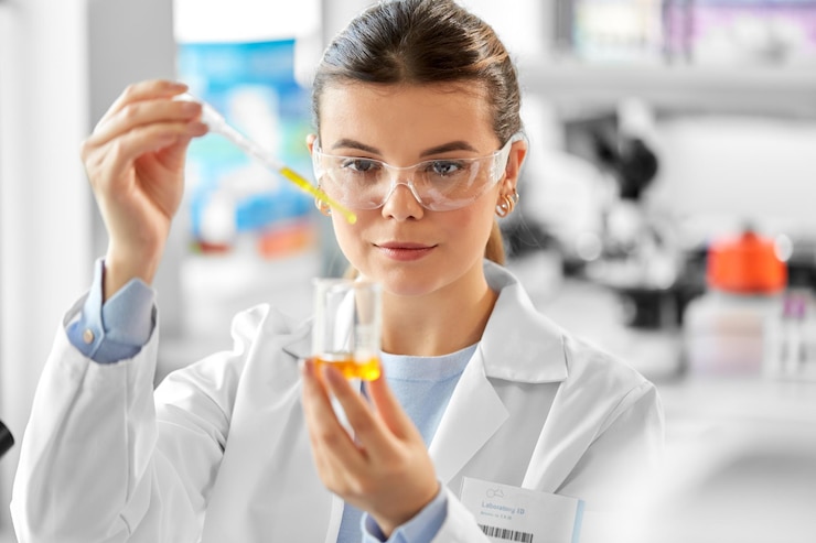 Photo scientist with chemical working in laboratory