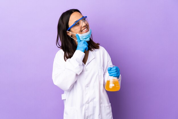 Scientist woman investigating a vaccine to cure coronavirus disease thinking an idea while looking up