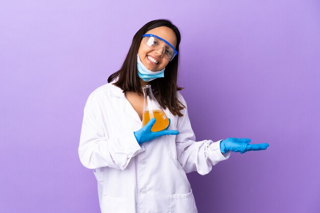 Scientist woman investigating a vaccine to cure disease holding blank space on the palm