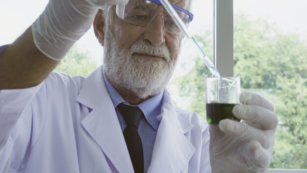 Scientist work with science equipment in laboratory.