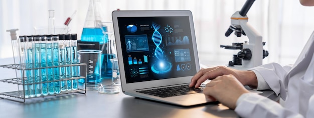 scientist working on advance biotechnology computer software to study or analyze dna data after making scientific breakthrough from chemical experiment on medical laboratory neoteric