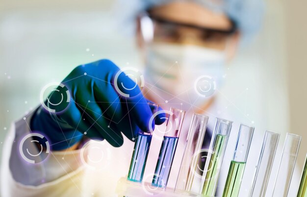 Scientist working in laboratory with test tubes , laboratory equipment