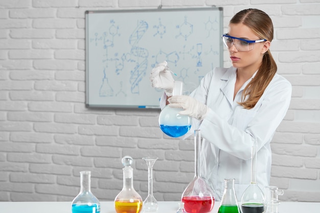 Scientist works with the chemical liquids