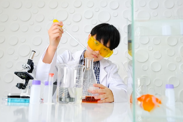 Scientists are working in laboratory. Young female researcher 