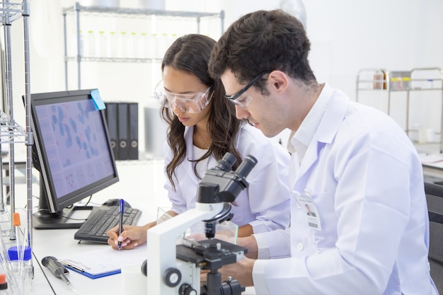 Scientists or chemists working in a laboratory together