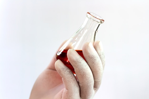 Scientists holding test bottles on a white background.