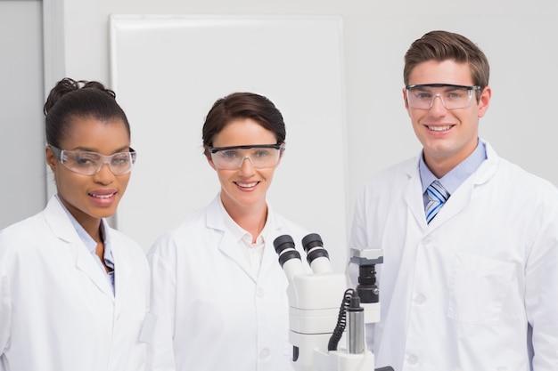 Scientists smiling and looking at camera