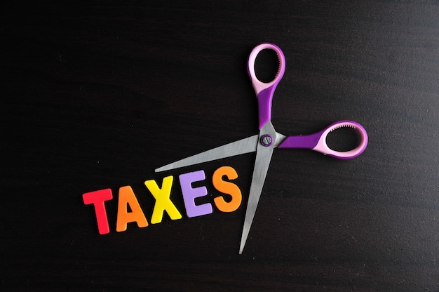 Scissors and the alphabet TAXES