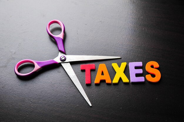 Scissors and the alphabet TAXES