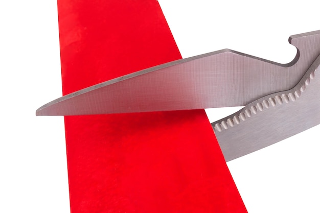 Scissors cut isolated on white background red ribbon paper