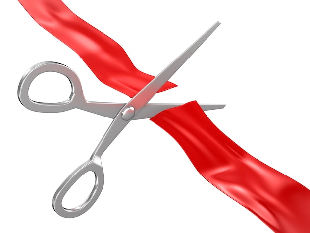 Scissors cutting red ribbon