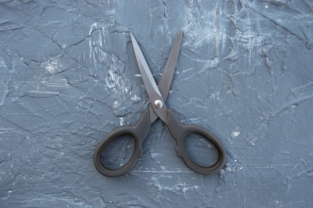 scissors on a grey background