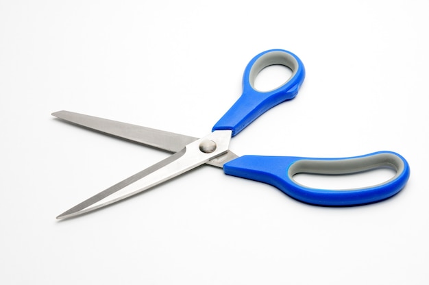 Scissors with a blue handle for tailors on an isolated white