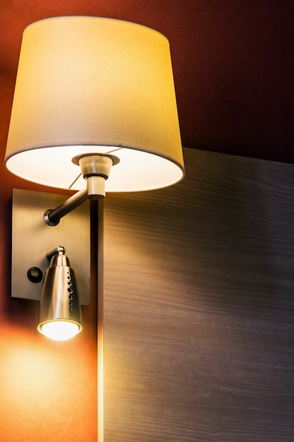 Photo sconce over the bed in the room or hotel room