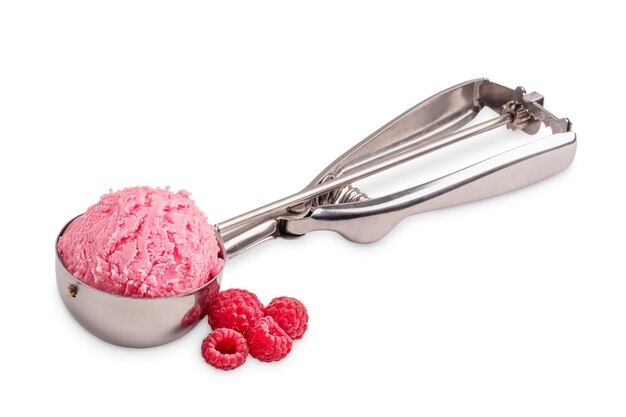 Scoop of berry pink ice cream in metal spoon with juicy ripe raspberries on white background