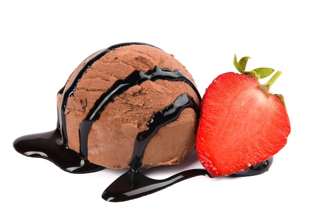 Photo scoop of chocolate ice cream with syrup and strawberry isolated on white