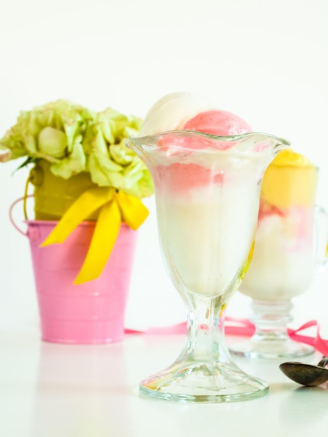 Scoop of delicious Italian fresh ice cream on white background.